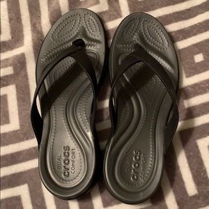 Crocs black flip flops